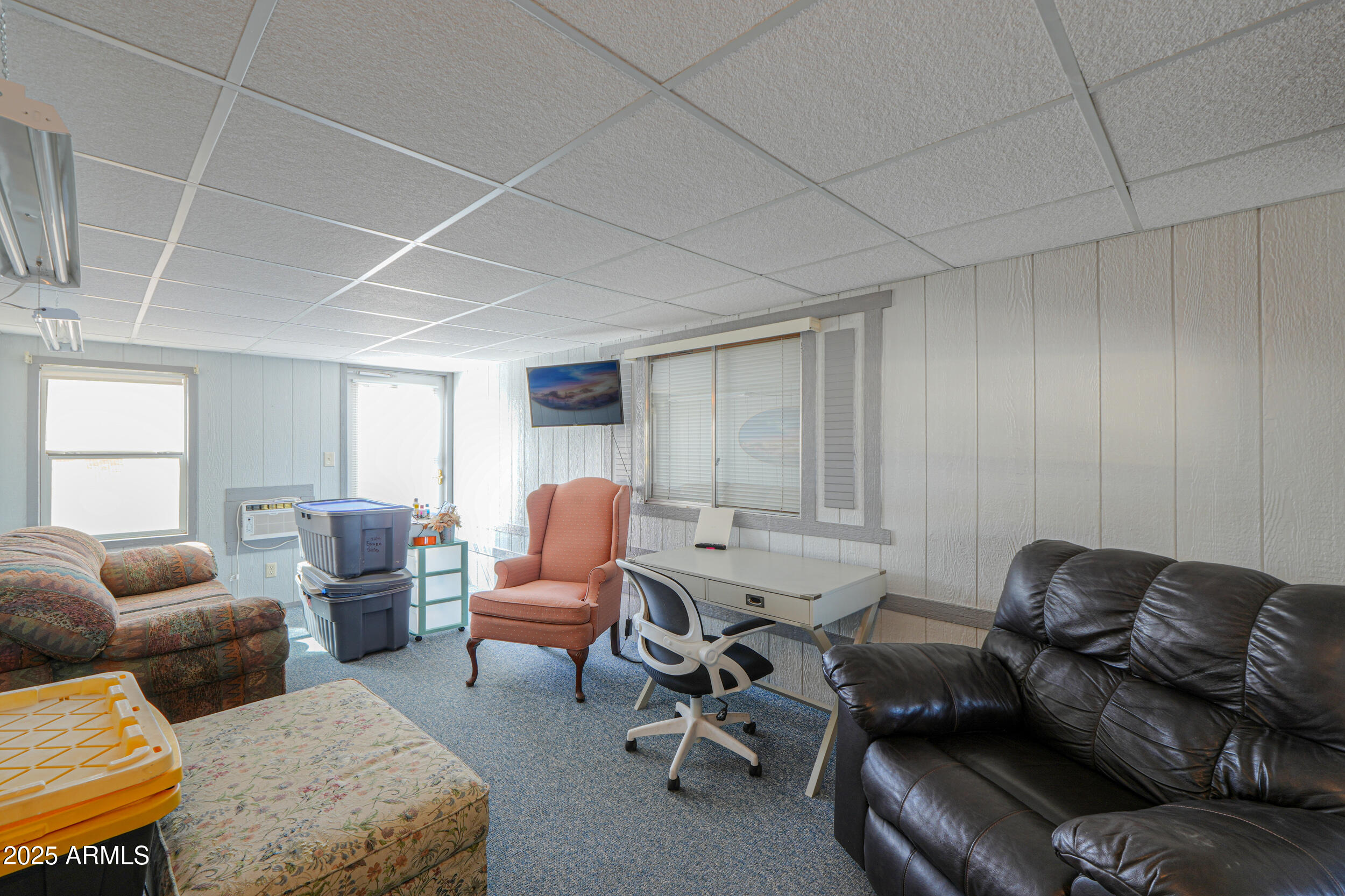 2208 West Baseline Avenue, Unit 40 Apache Junction, AZ 85120 - Photo 19 of 30 a living room with furniture and a window