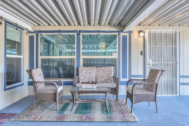 a outdoor living space with furniture and a rug