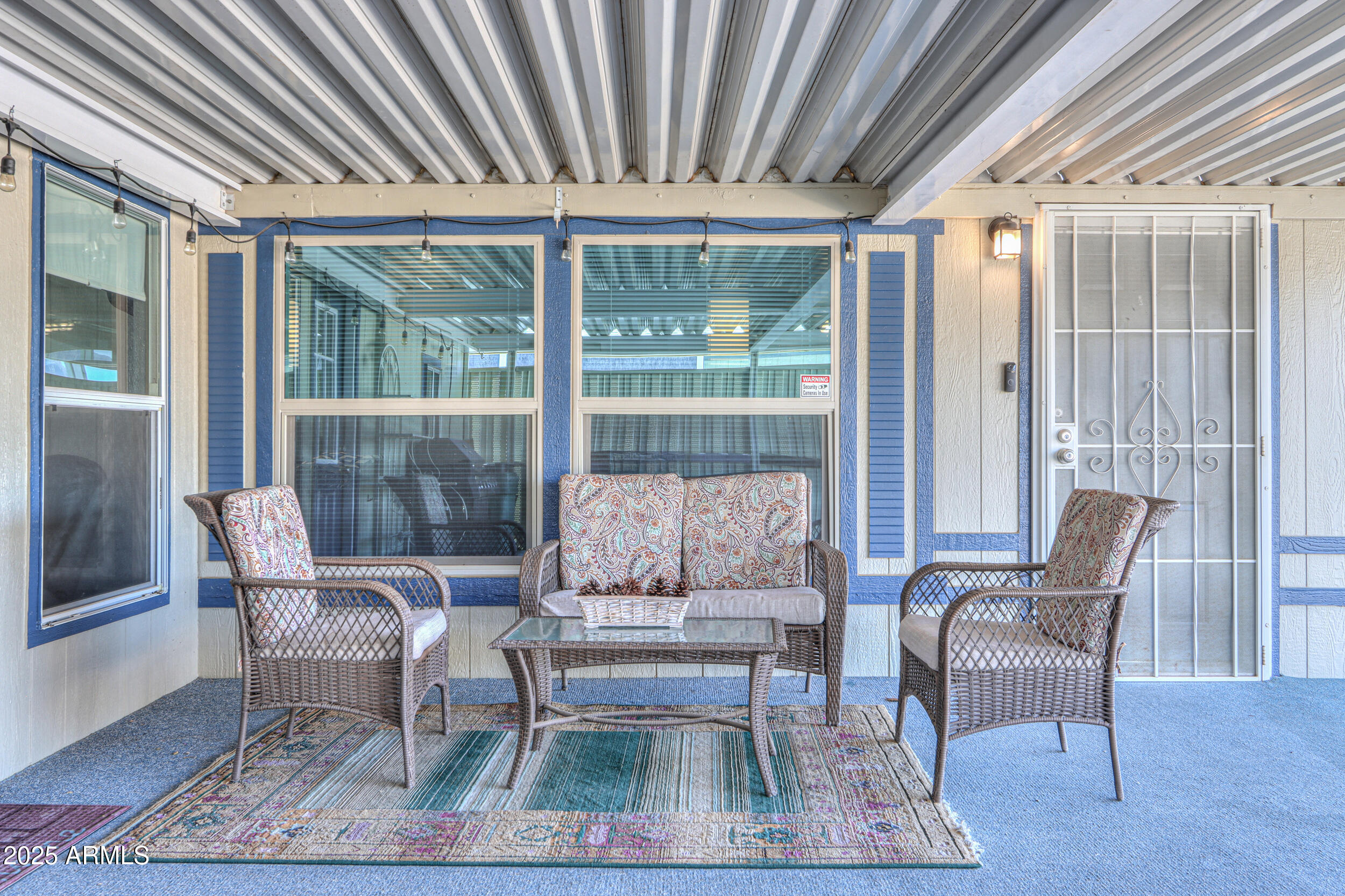 2208 West Baseline Avenue, Unit 40 Apache Junction, AZ 85120 - Photo 2 of 30 a outdoor living space with furniture and a rug
