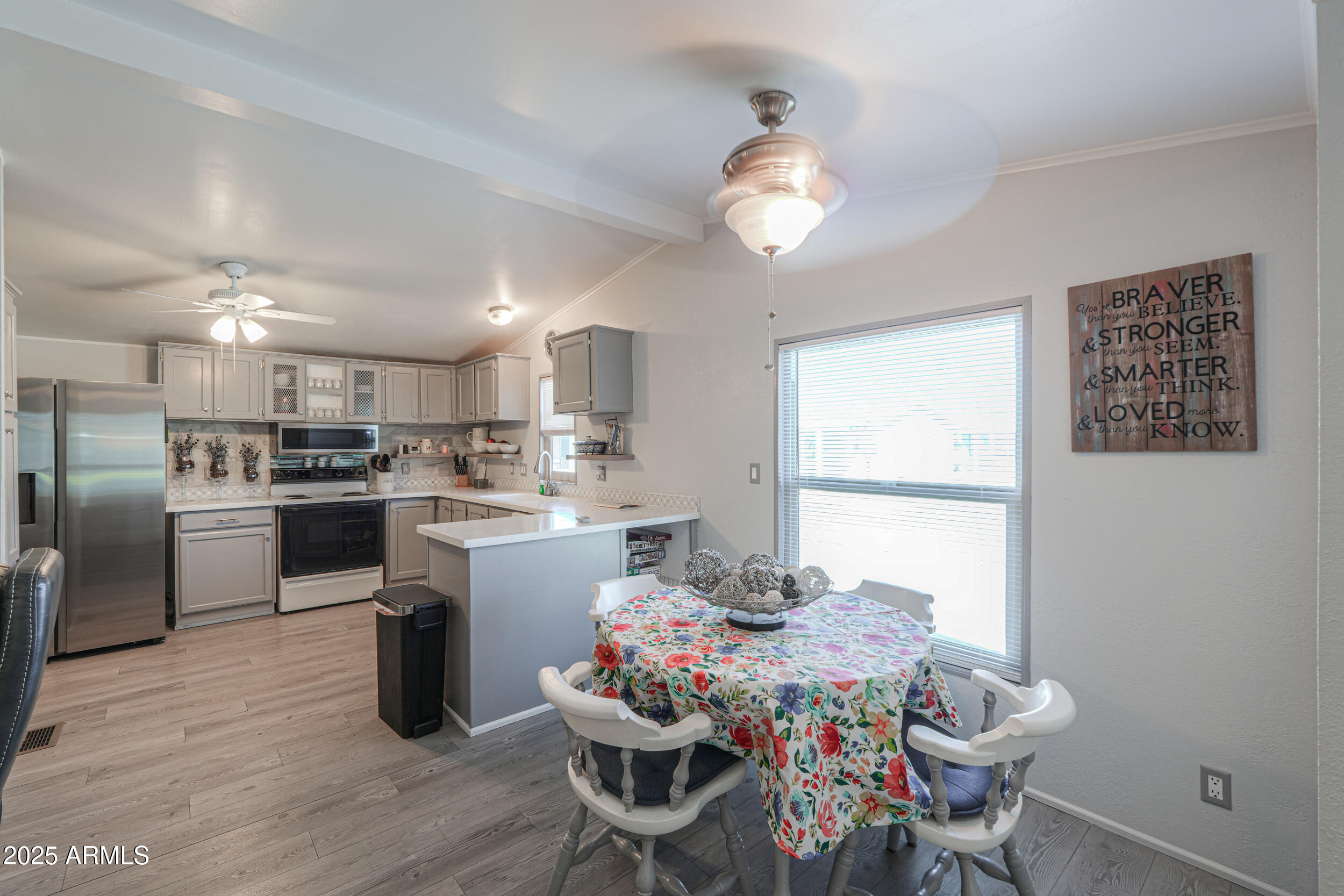 2208 West Baseline Avenue, Unit 40 Apache Junction, AZ 85120 - Photo 3 of 30 a kitchen with a table and chairs