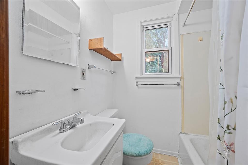 3708 Grant Street Pittsburgh, PA 15234 - Photo 24 of 36 a bathroom with a sink and a toilet