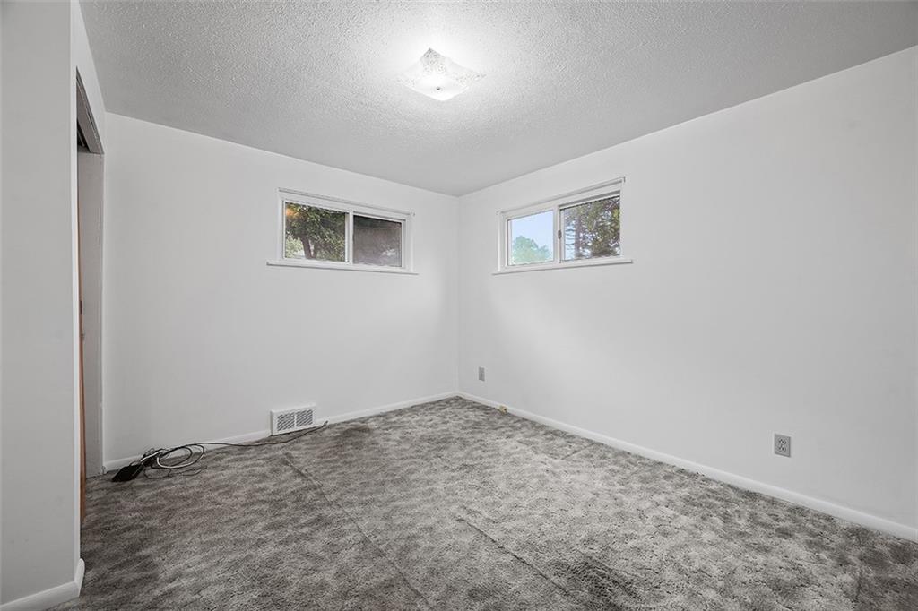 3708 Grant Street Pittsburgh, PA 15234 - Photo 25 of 36 an empty room with a workbench