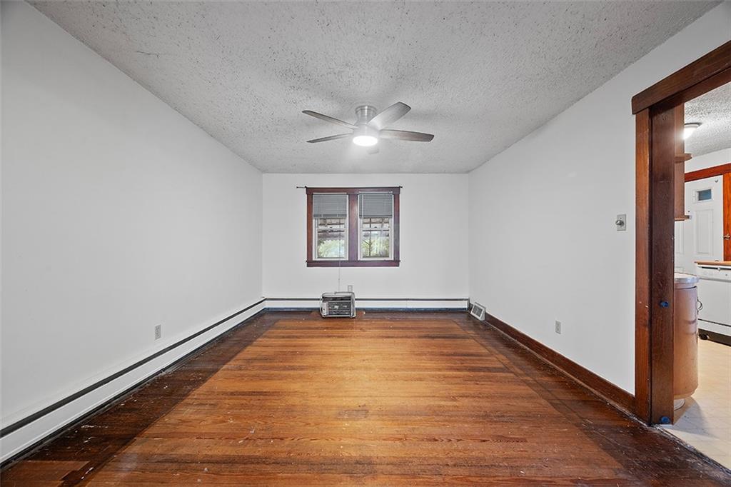 3708 Grant Street Pittsburgh, PA 15234 - Photo 6 of 36 wooden floor in an empty room with a window