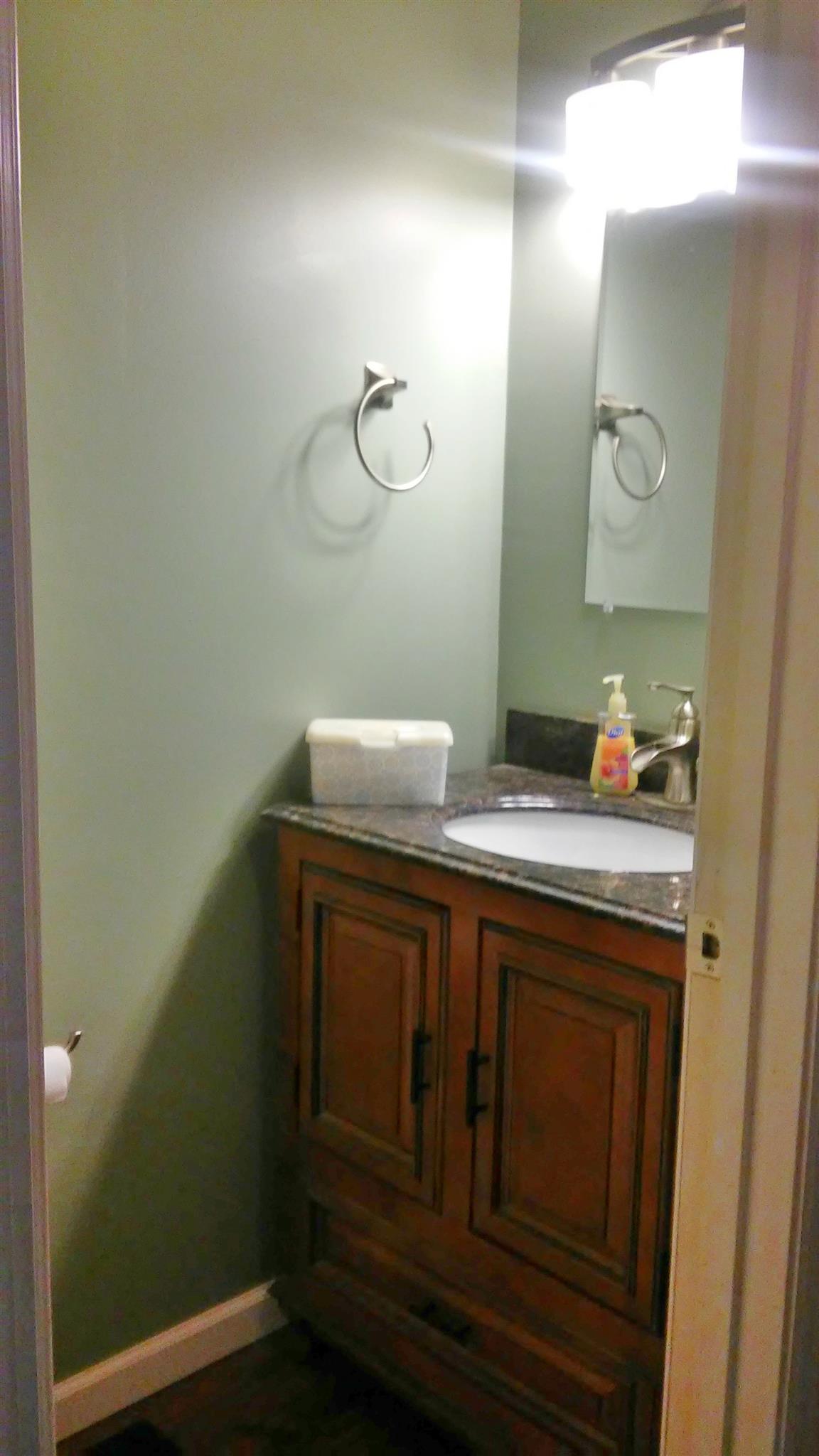 1001 Anderson Road Dickson, TN 37055 - Photo 6 of 9 a room with a sink and a mirror
