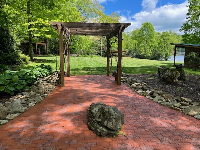 38 Rocky Meadows Road Newland, NC 28657 - Photo 46 of 50 a view of a backyard with a garden