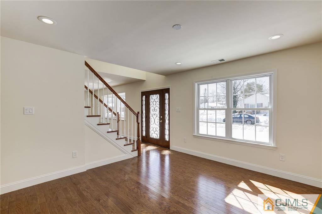29 Fairfax Road Edison, NJ 08817 - Photo 11 of 21 a view of an empty room with wooden floor and a window
