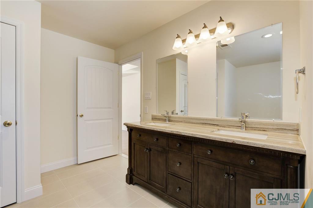 29 Fairfax Road Edison, NJ 08817 - Photo 14 of 21 a bathroom with a sink double vanity and a mirror
