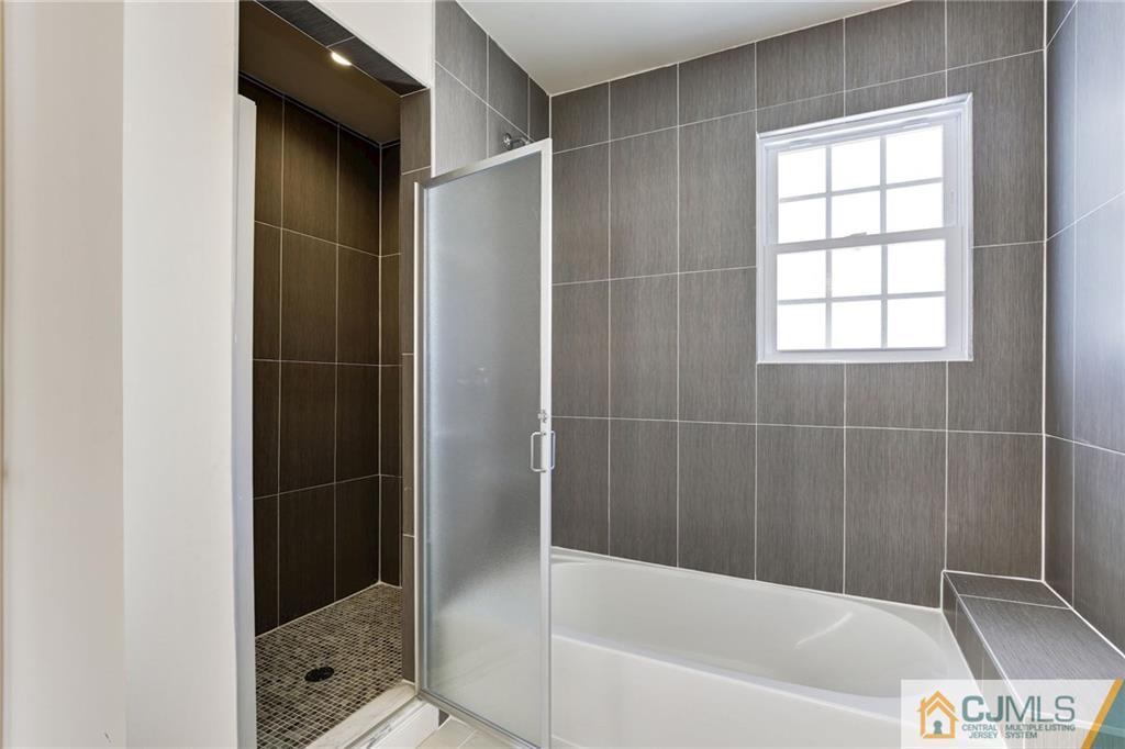 29 Fairfax Road Edison, NJ 08817 - Photo 19 of 21 a bathroom with a bathtub and a shower