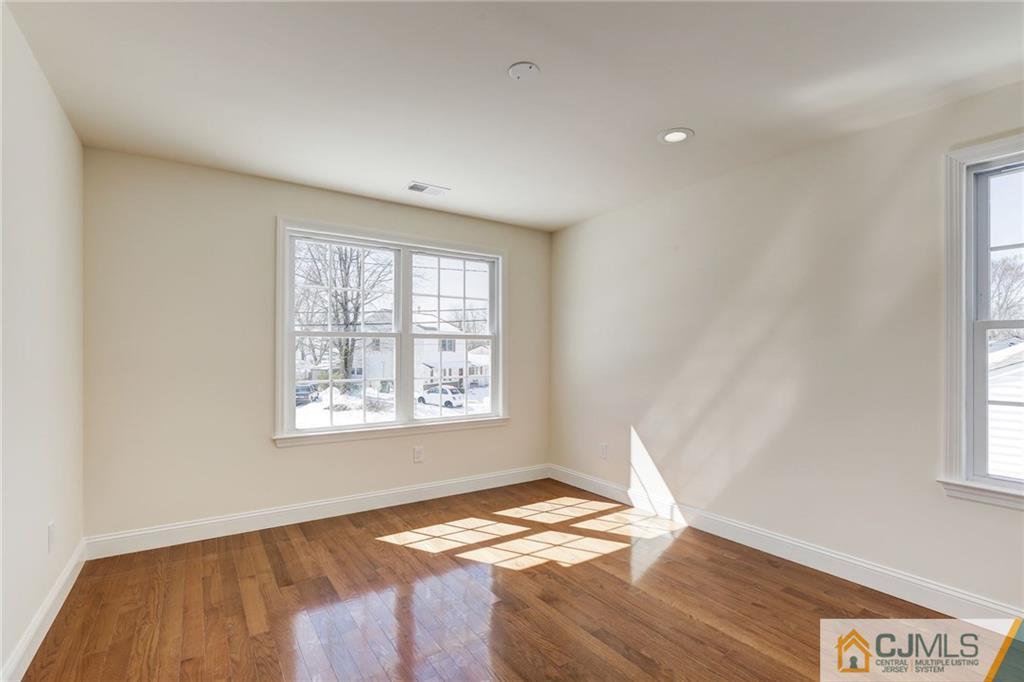 29 Fairfax Road Edison, NJ 08817 - Photo 20 of 21 a view of a bedroom with wooden floor and window