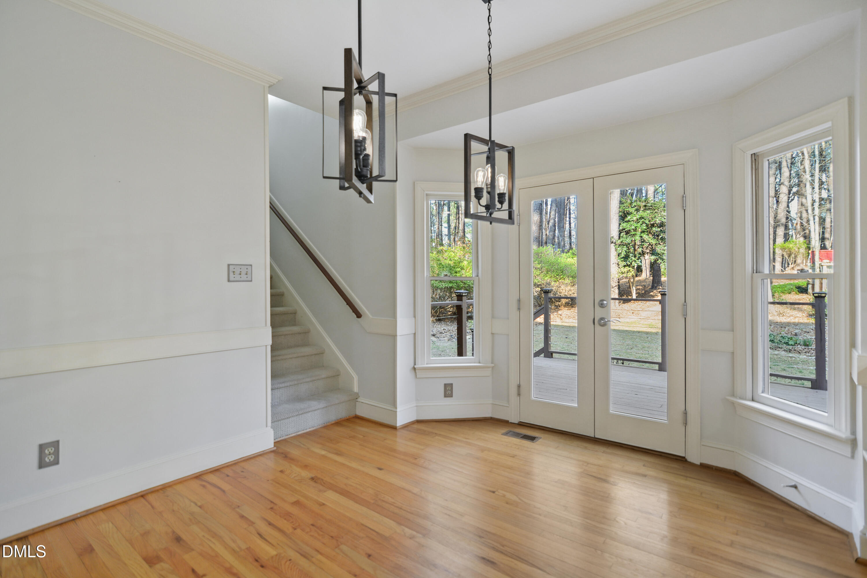 5008 Wood Valley Drive Raleigh, NC 27613 - Photo 11 of 37 a view of empty room with wooden floor and fan