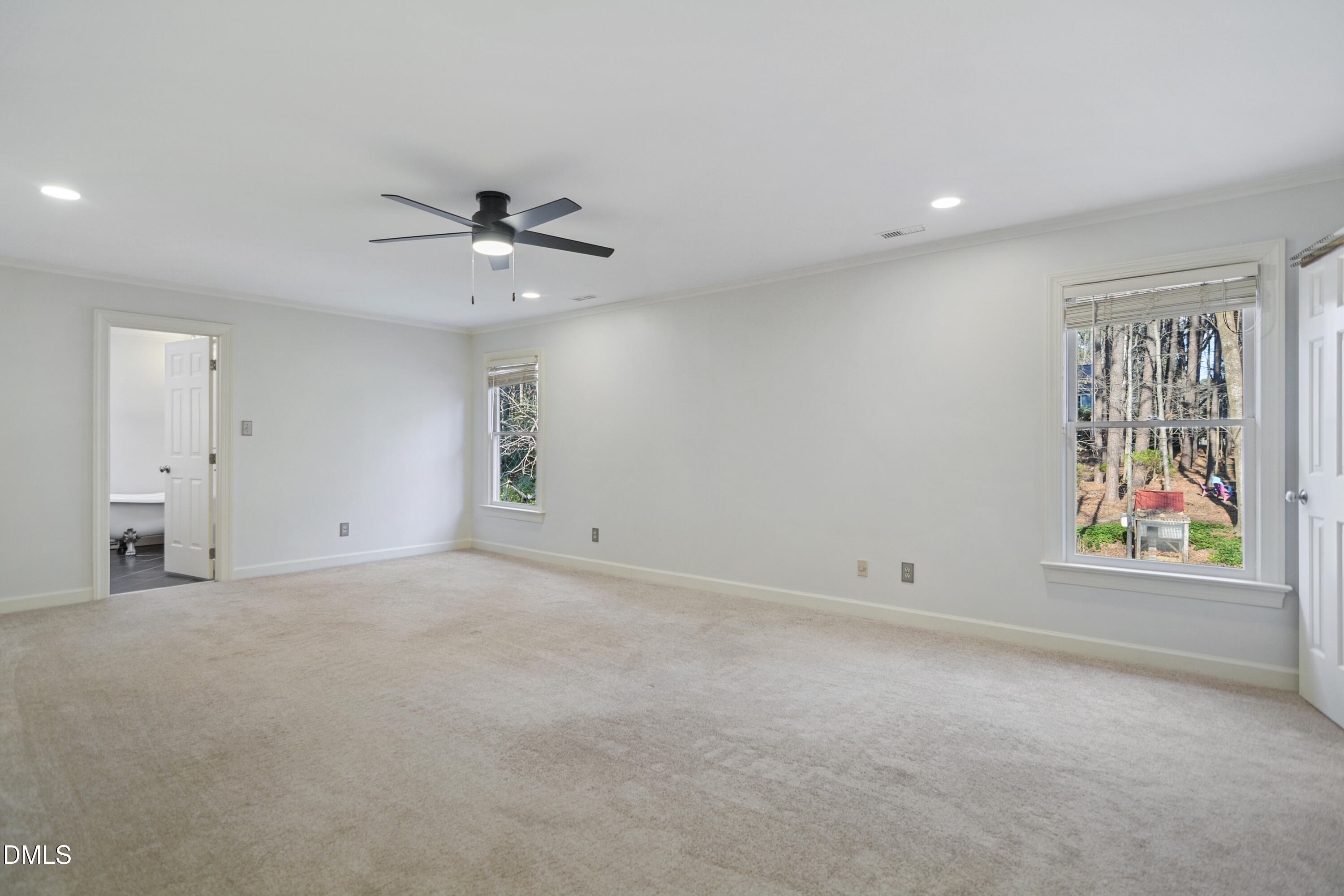 5008 Wood Valley Drive Raleigh, NC 27613 - Photo 14 of 37 wooden floor in an empty room with a window