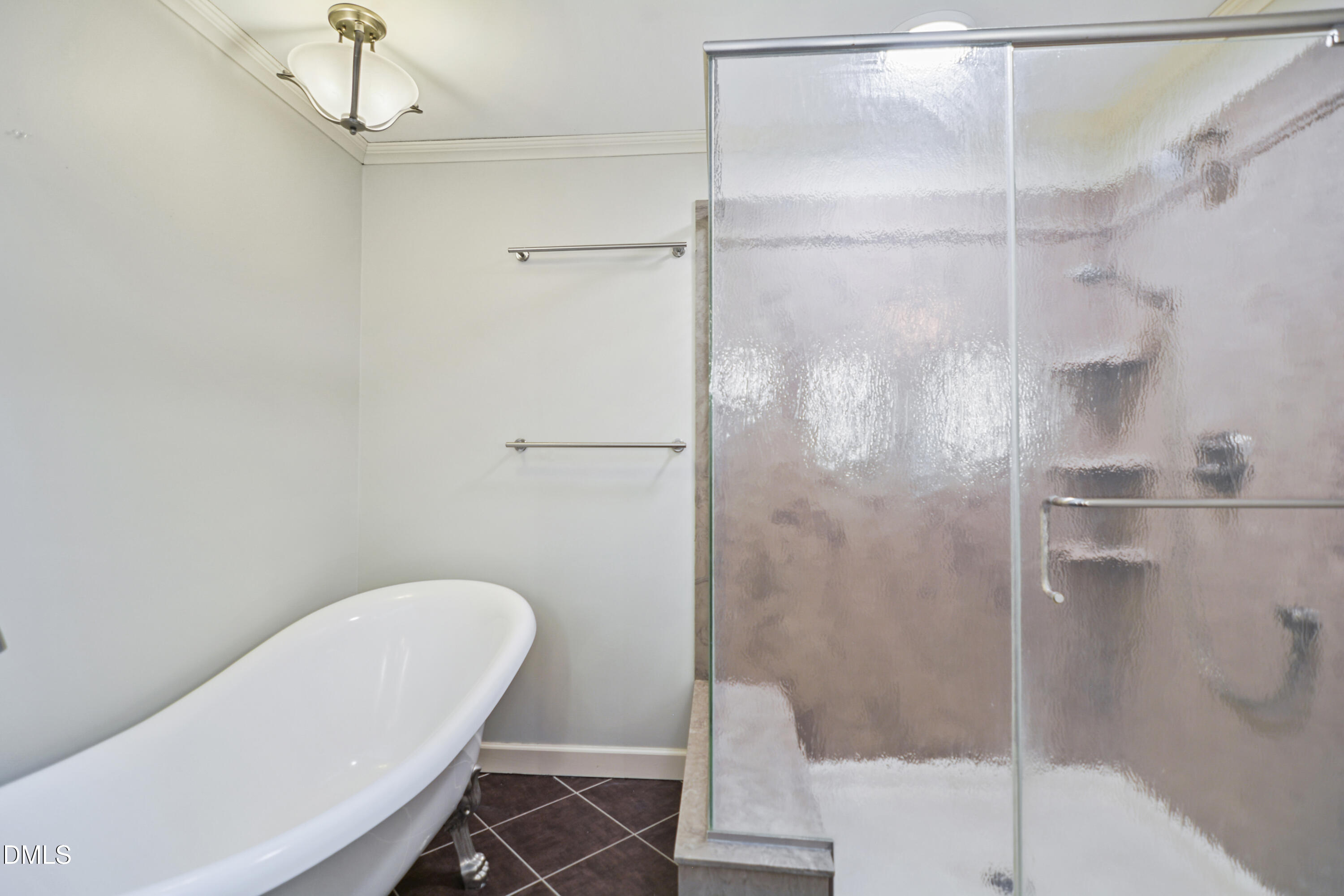 5008 Wood Valley Drive Raleigh, NC 27613 - Photo 17 of 37 a bathroom with a shower and toilet