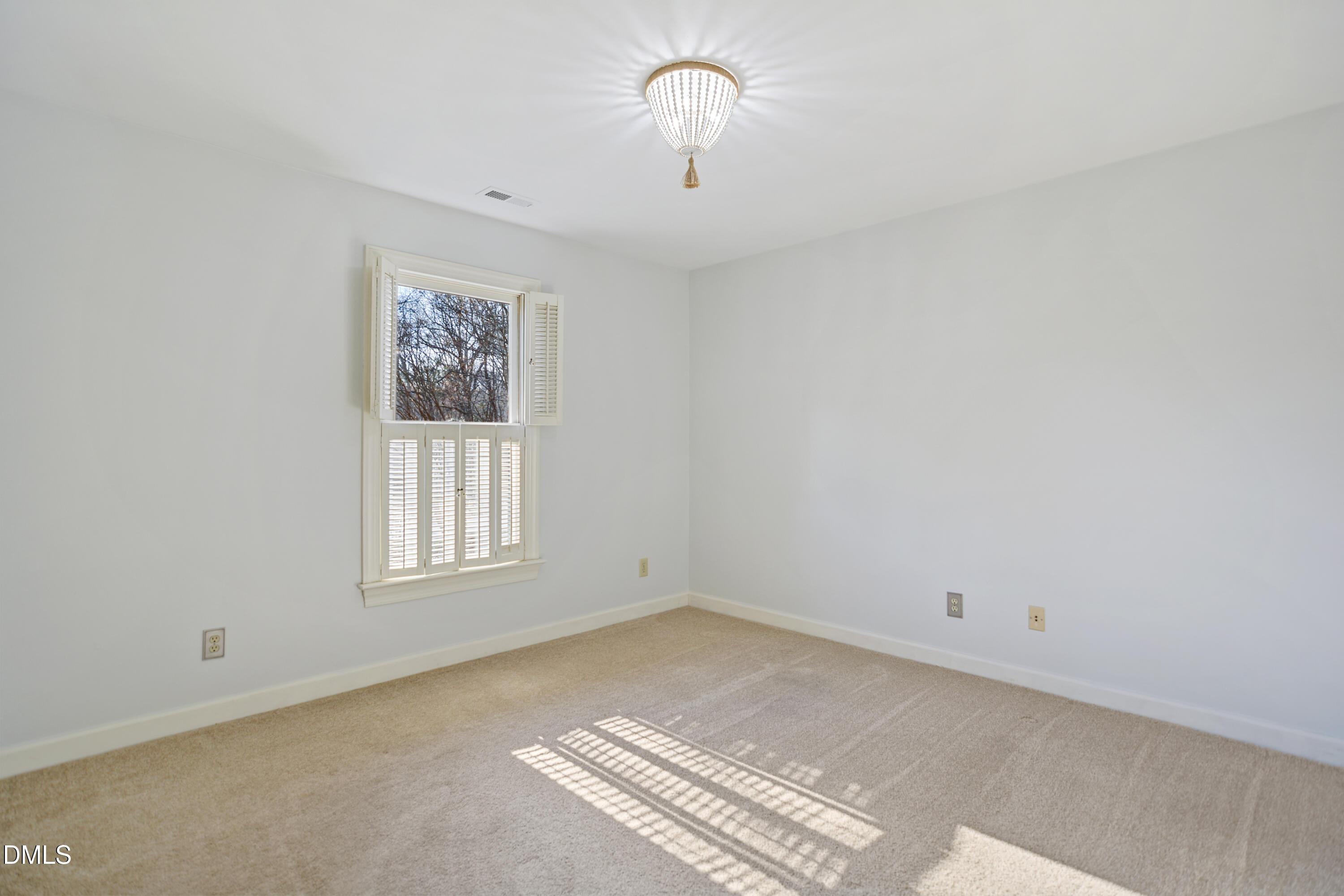 5008 Wood Valley Drive Raleigh, NC 27613 - Photo 19 of 37 an empty room with windows