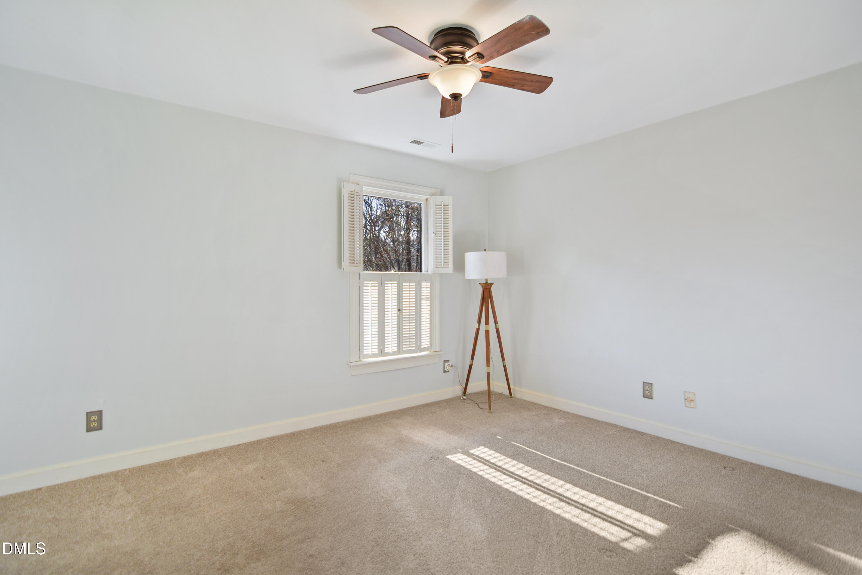 5008 Wood Valley Drive Raleigh, NC 27613 - Photo 21 of 37 a view of an empty room with a window