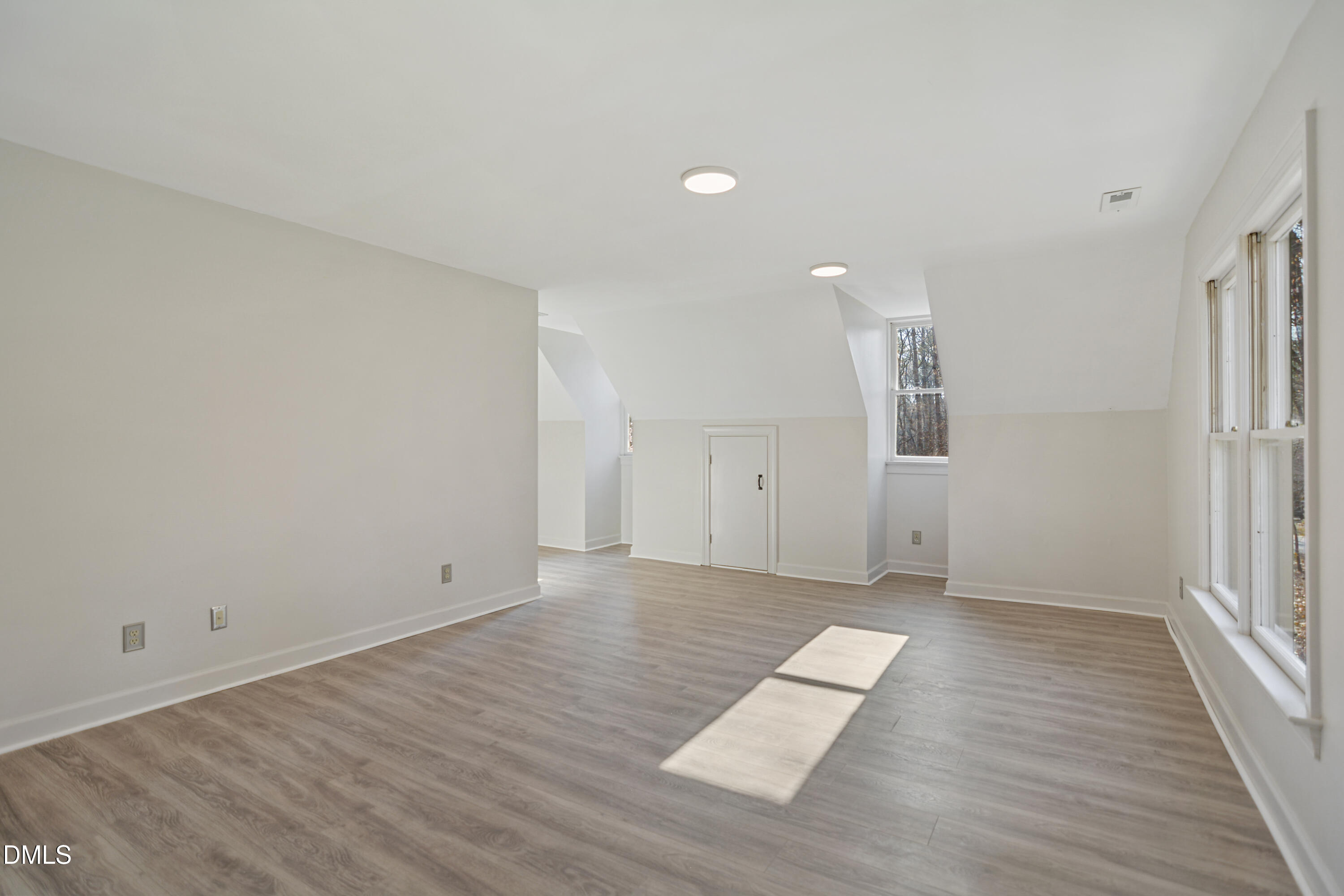 5008 Wood Valley Drive Raleigh, NC 27613 - Photo 25 of 37 wooden floor in an empty room with a window