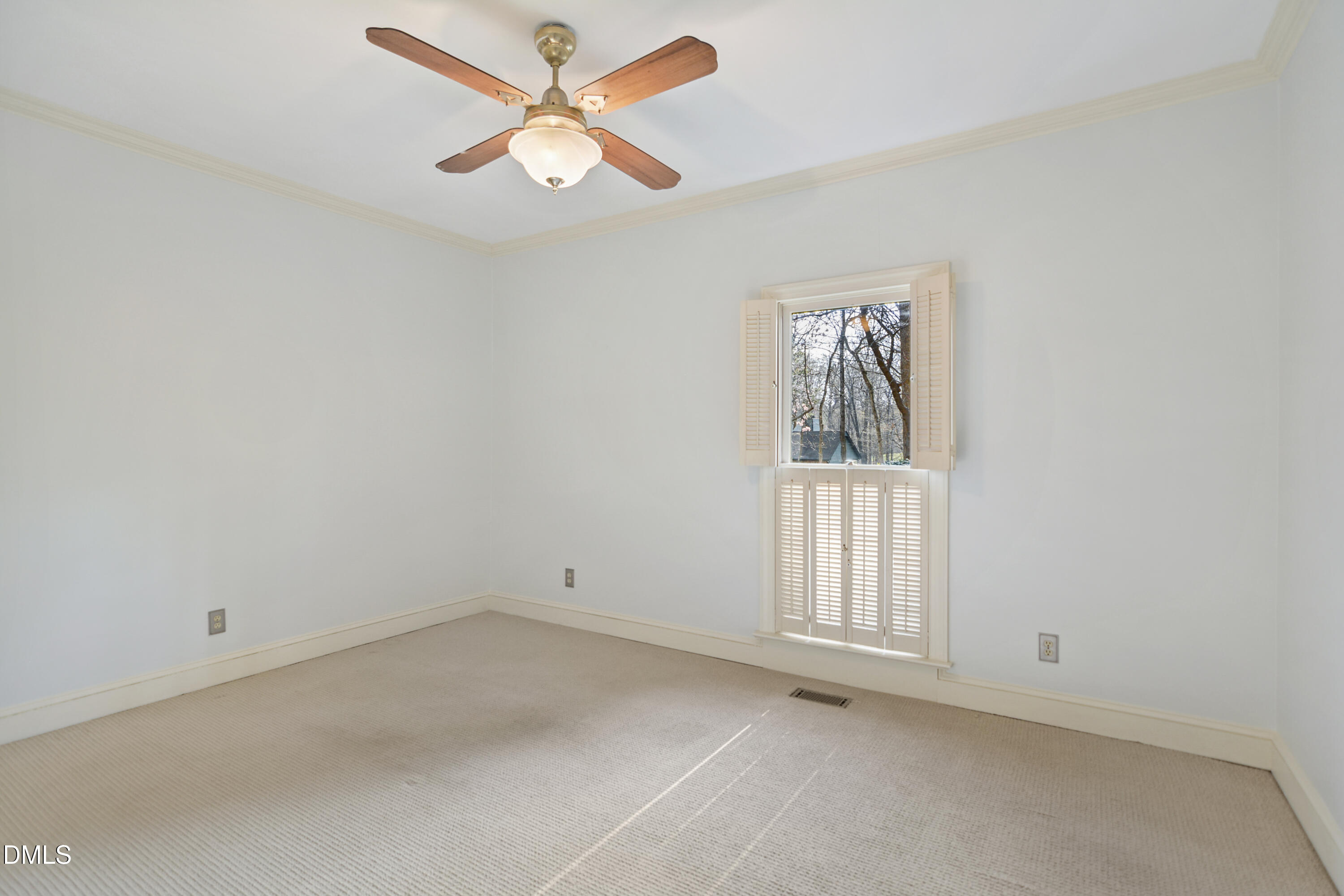 5008 Wood Valley Drive Raleigh, NC 27613 - Photo 27 of 37 an empty room with windows and fan