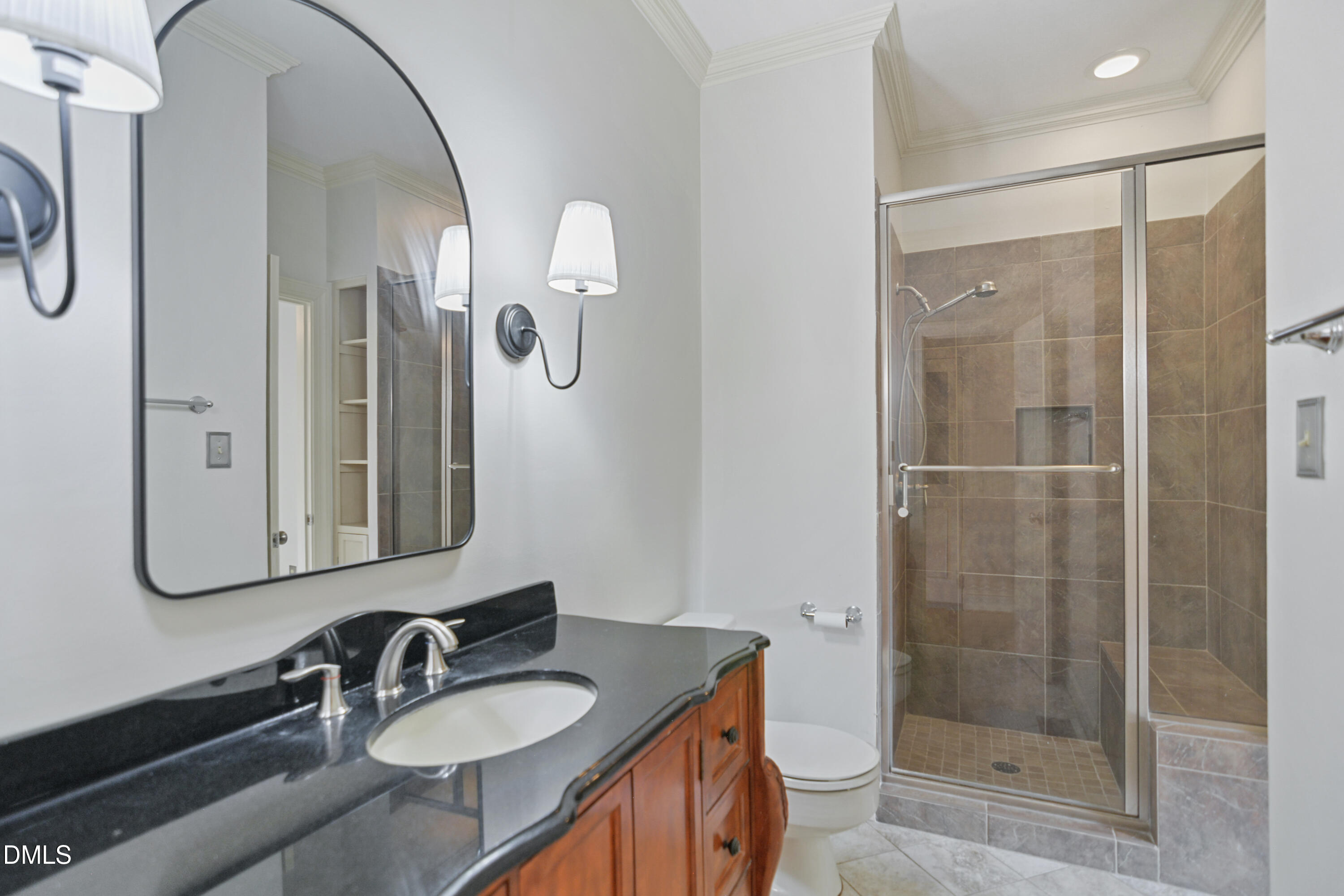 5008 Wood Valley Drive Raleigh, NC 27613 - Photo 28 of 37 a bathroom with a granite countertop sink toilet and shower