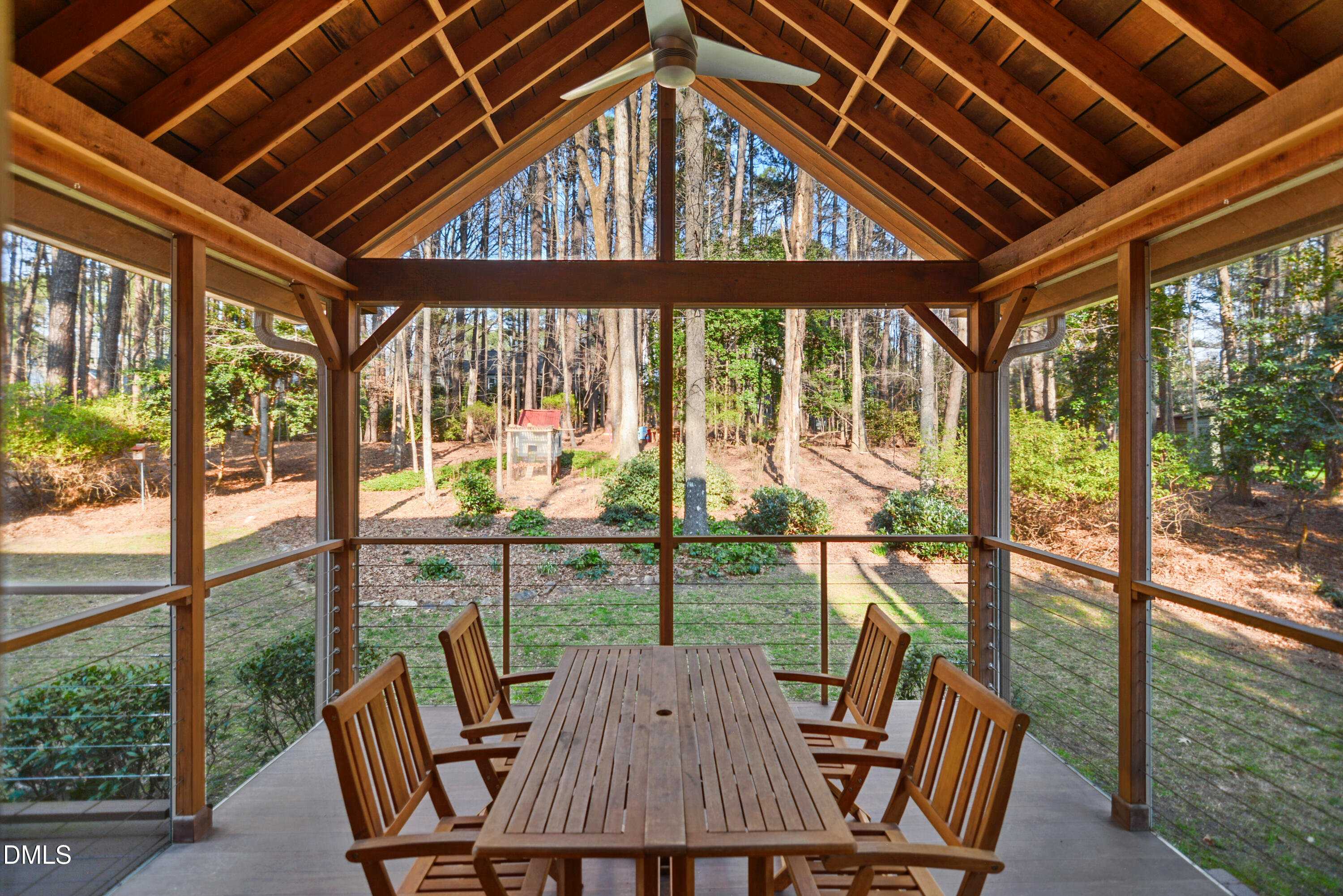 5008 Wood Valley Drive Raleigh, NC 27613 - Photo 29 of 37 a view of a porch with furniture and wooden floor