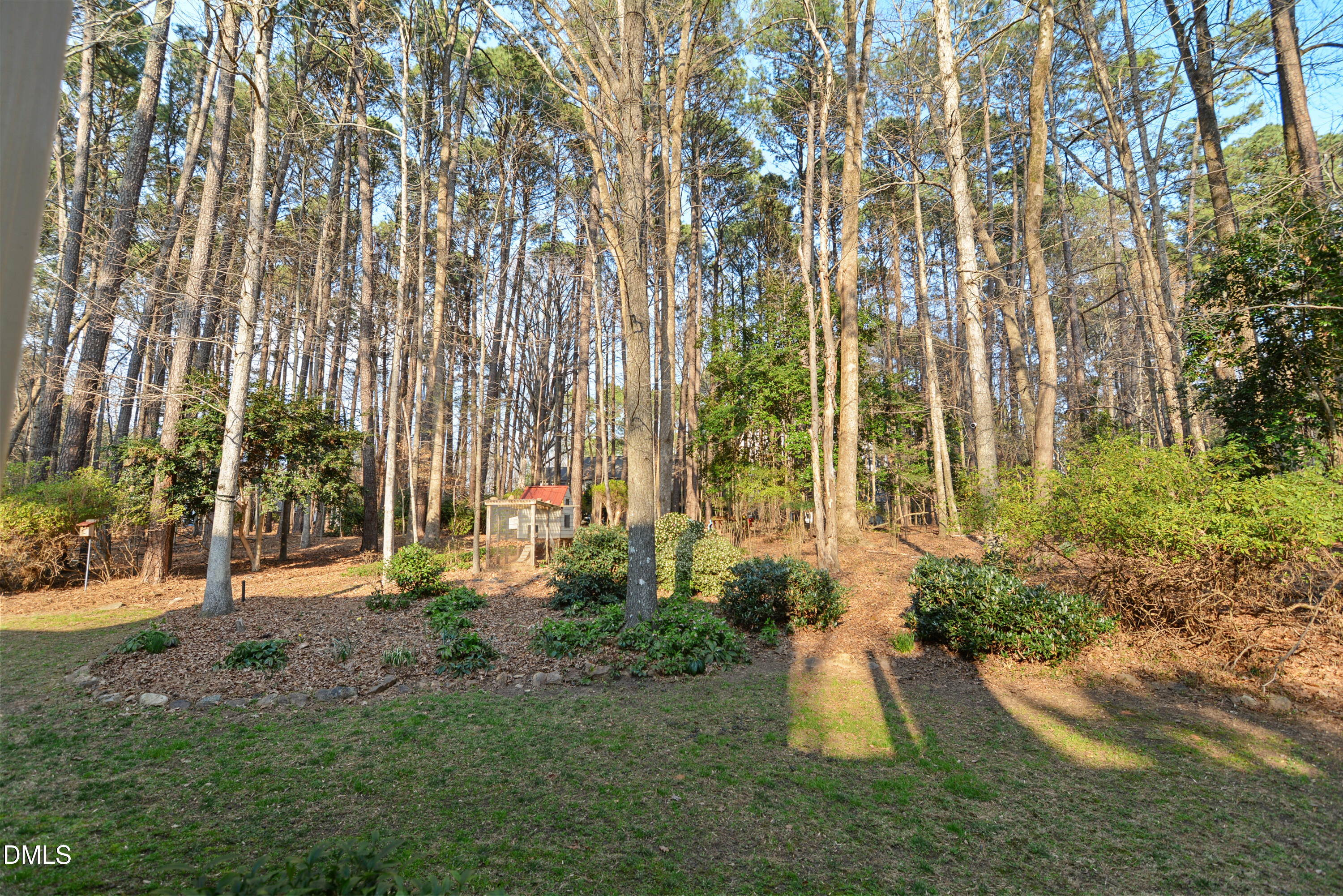 5008 Wood Valley Drive Raleigh, NC 27613 - Photo 35 of 37 front view of a house with a yard and an trees