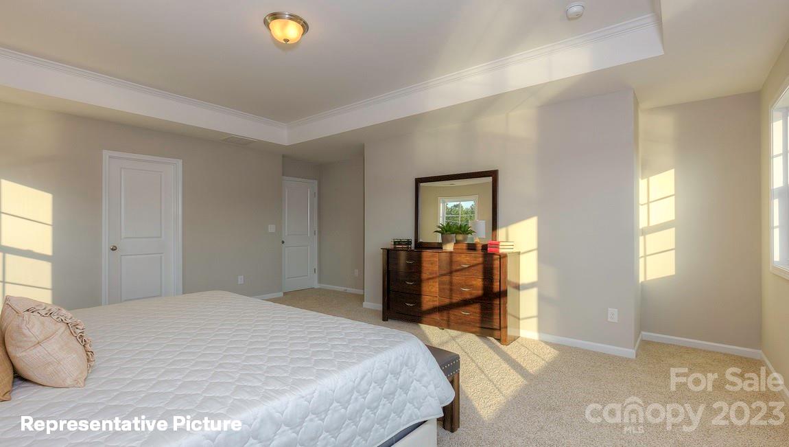 312 Streamwood Road Troutman, NC 28166 - Photo 29 of 39 a bedroom with a bed and window