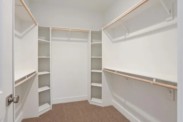 a view of an empty walk in closet