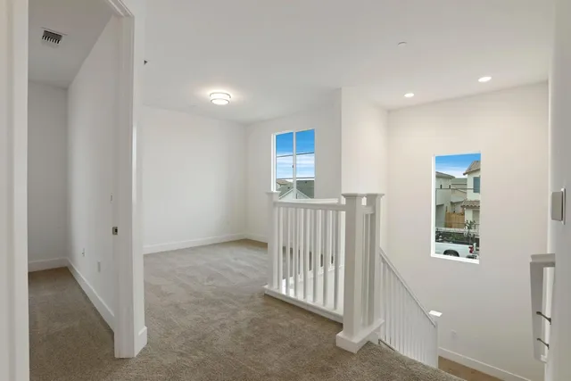 a view of a hallway with windows