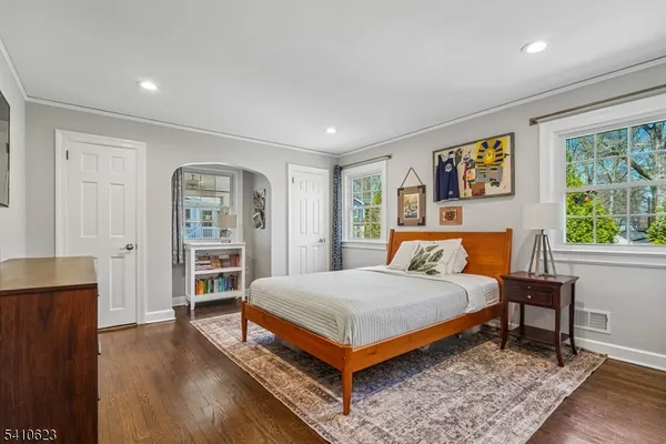 a bedroom with a bed and a table in it