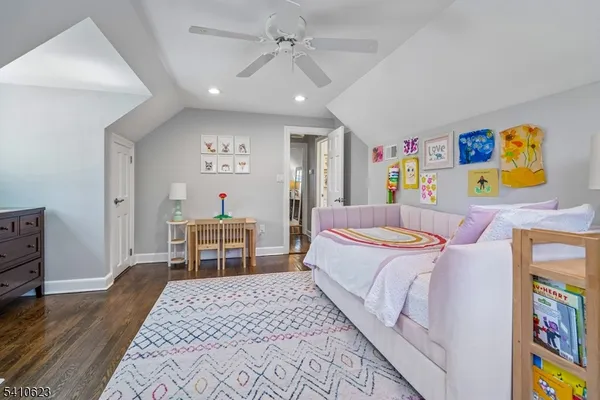 a bedroom with a bed and a table in it