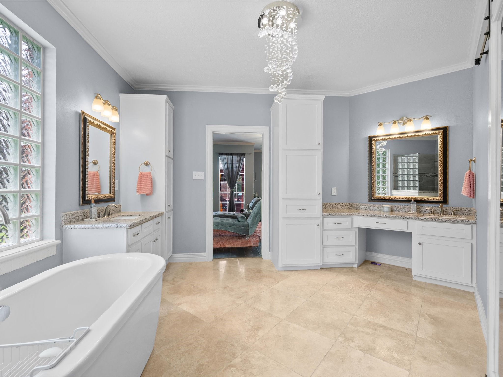 16123 Lafone Drive Spring, TX 77379 - Photo 21 of 47 Dual sinks, custom built-ins, and an oversized soaking tub combine to create a beautifully appointed primary bath with exceptional space and functionality.