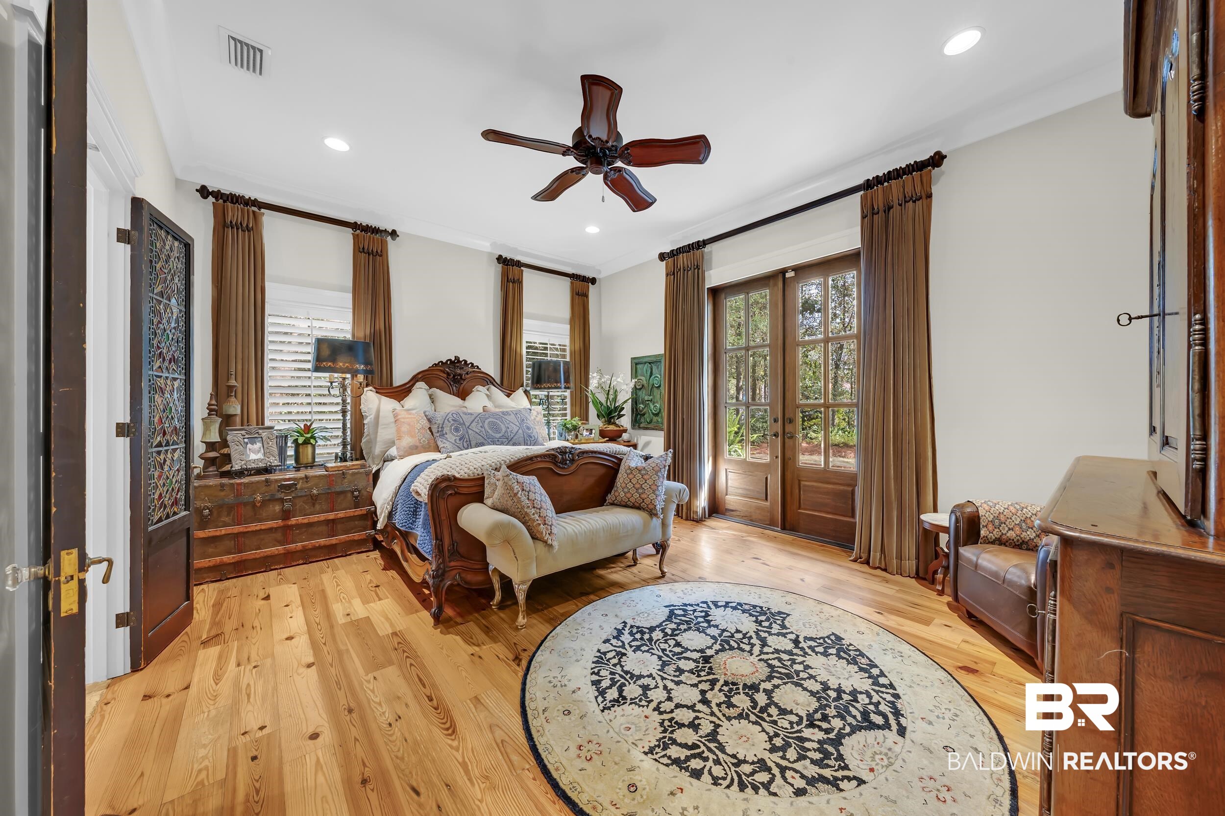 12161 Jessamine Street Magnolia Springs, AL 36555 - Photo 25 of 70 Bedroom featuring light wood-style floors, access to outside, french doors, ceiling fan, and crown molding