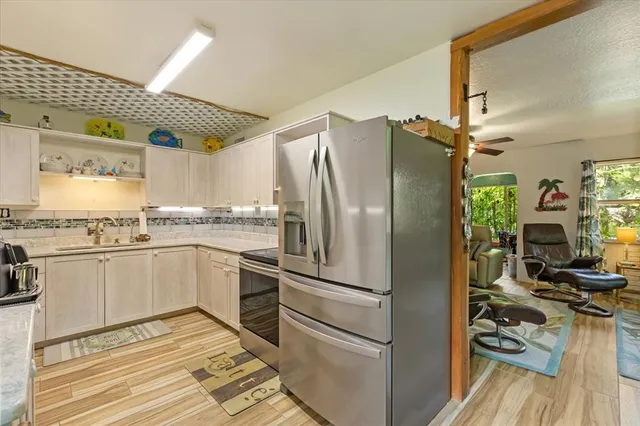 a room with furniture a rug and a window