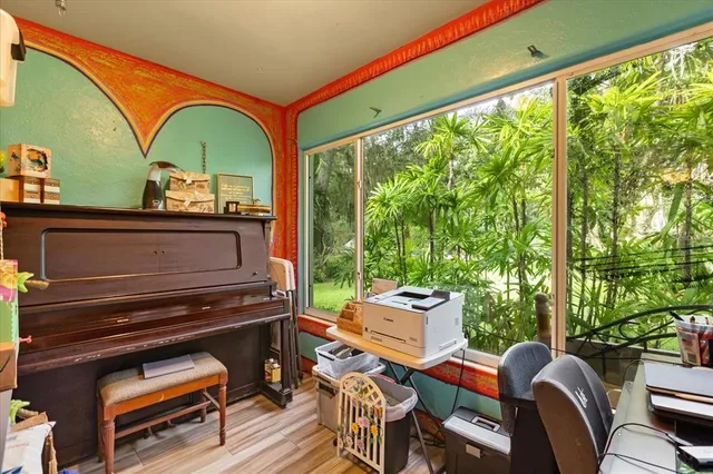 a view of a livingroom with furniture and windows