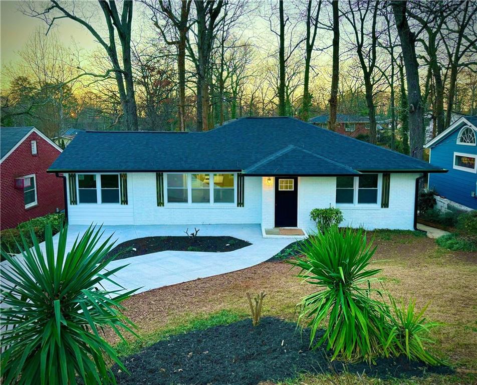 1705 Shirley Street Southwest Atlanta, GA 30310 - Photo 1 of 1 a front view of a house with yard and green space
