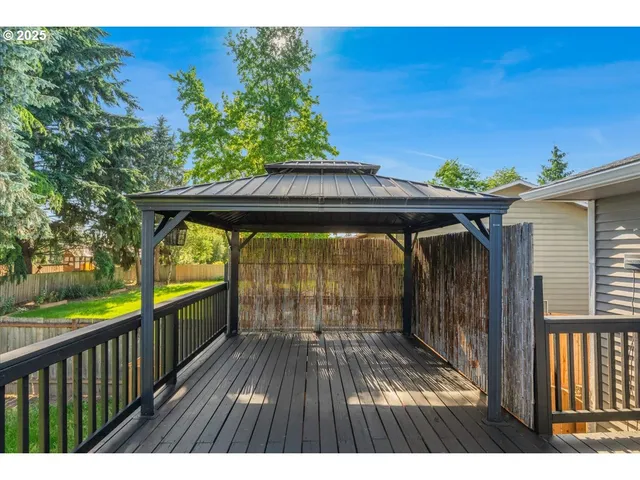 a view of outdoor space with deck and yard