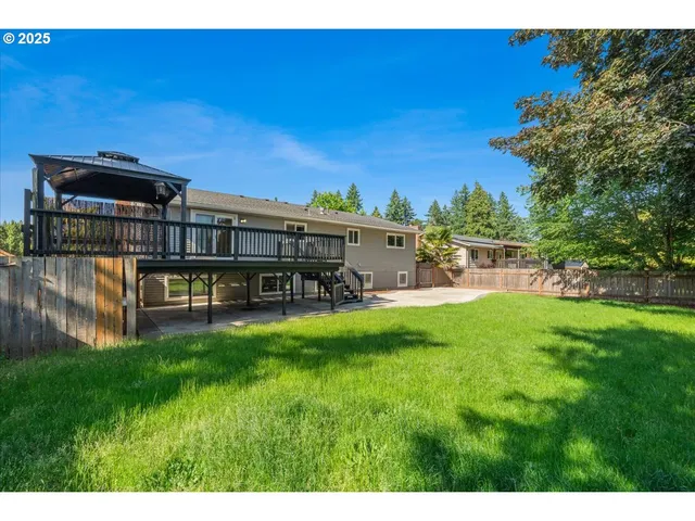 a view of a house with a yard porch and sitting area