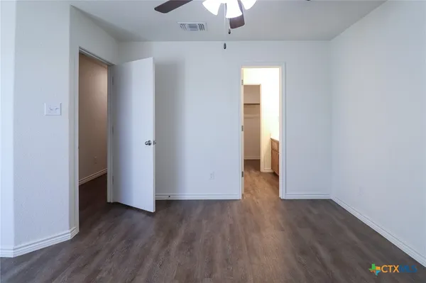 a bathroom with a toilet and a bathtub