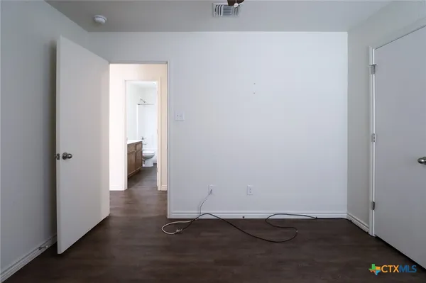 a view of a small space with wooden floor