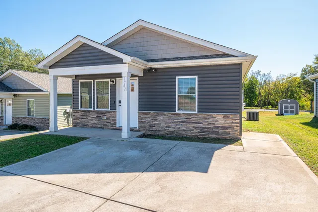 a front view of a house with yard