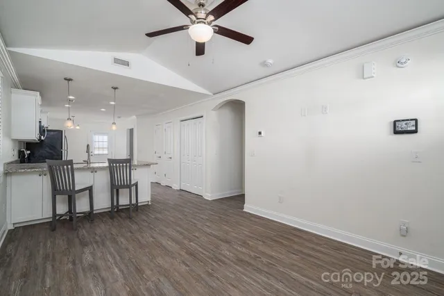 a view of kitchen with furniture and wooden floor