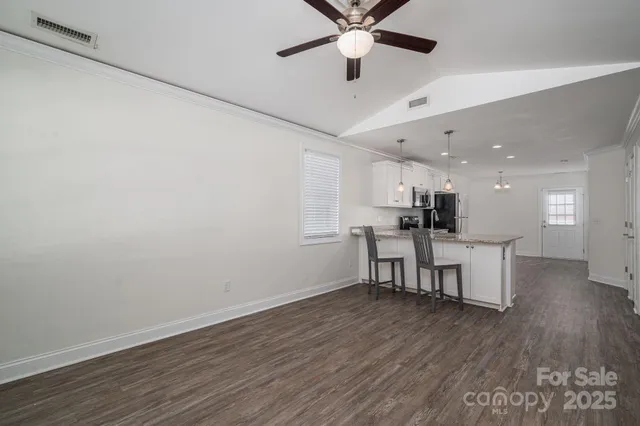 a kitchen with a table and chairs