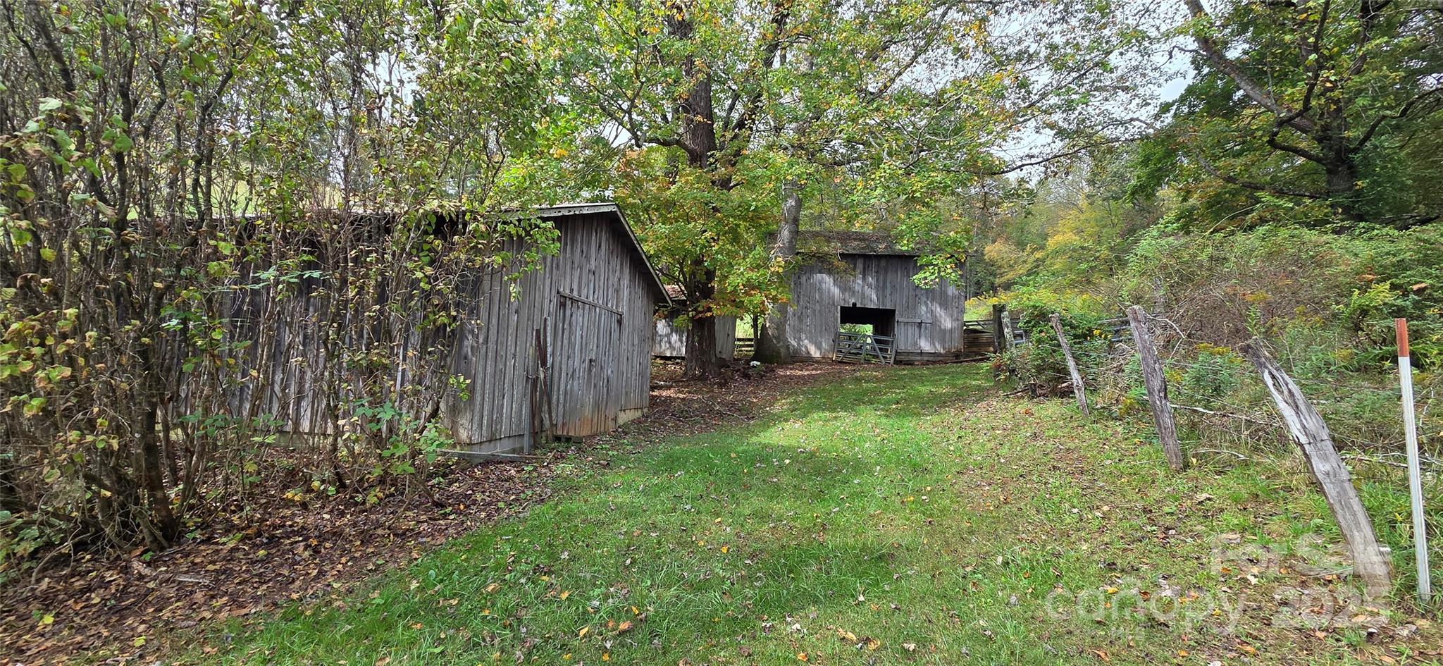 214 Old Dale Road Spruce Pine, NC 28777 - Photo 11 of 42 a view of a house with backyard and garden