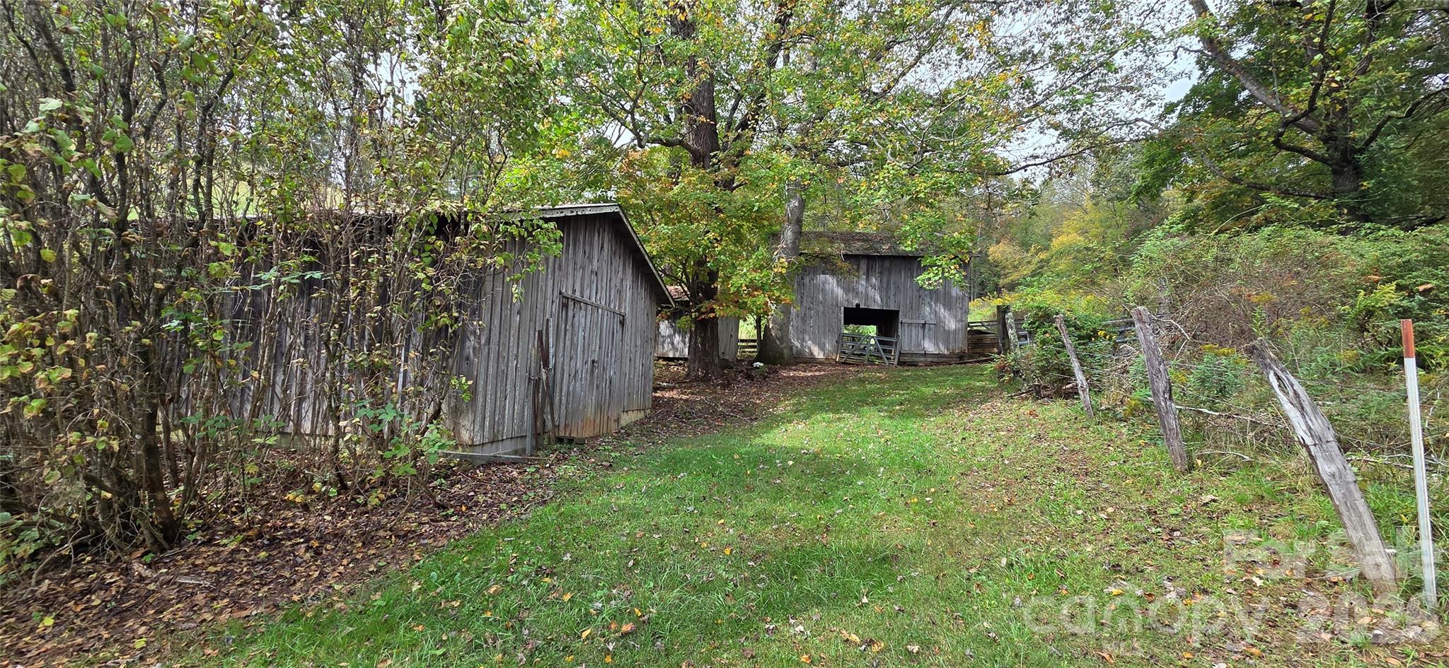 214 Old Dale Road Spruce Pine, NC 28777 - Photo 11 of 39 a view of a house with backyard and garden