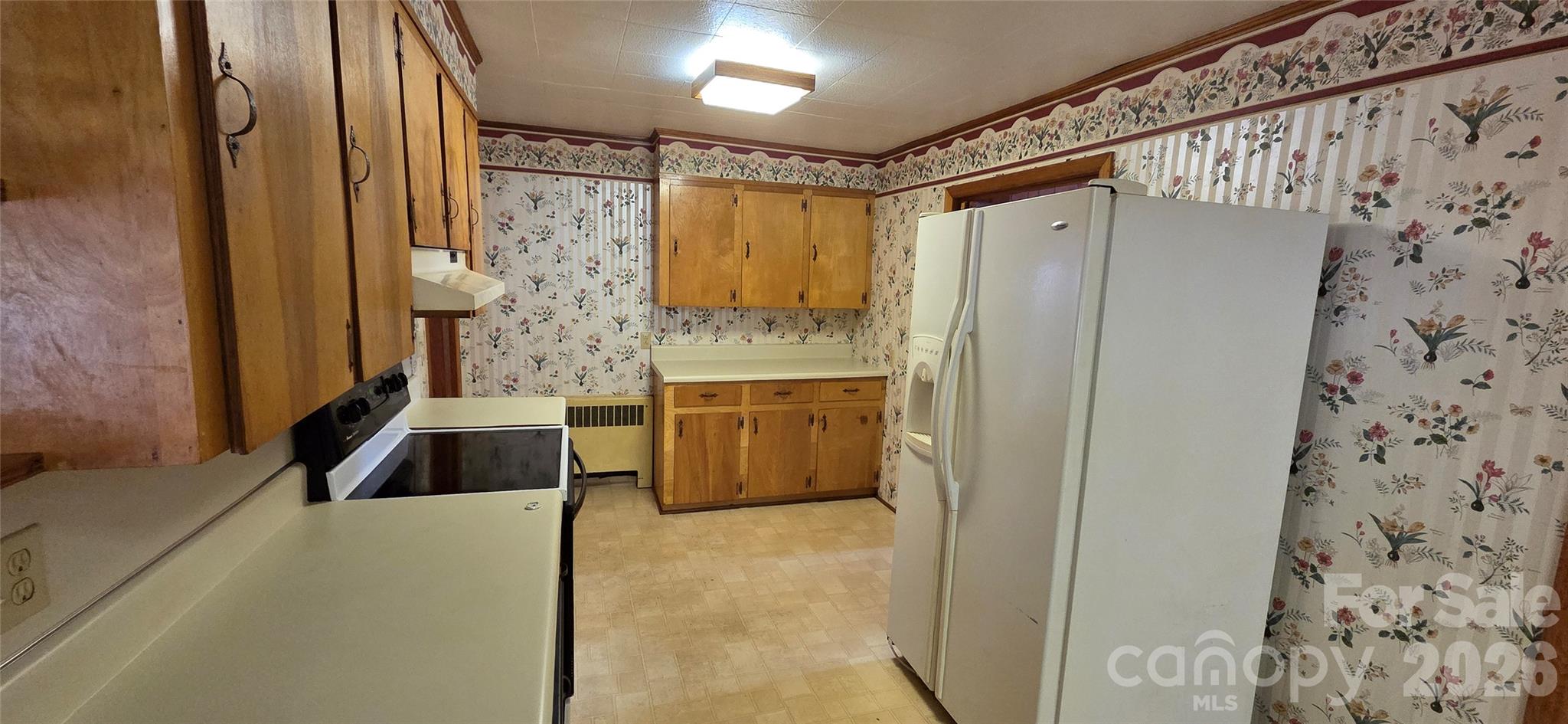 214 Old Dale Road Spruce Pine, NC 28777 - Photo 15 of 39 a bathroom with a granite countertop sink a vanity and a shower