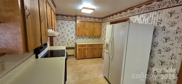 a bathroom with a granite countertop sink a vanity and a shower