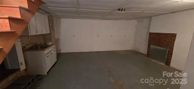 a kitchen with a refrigerator and a stove