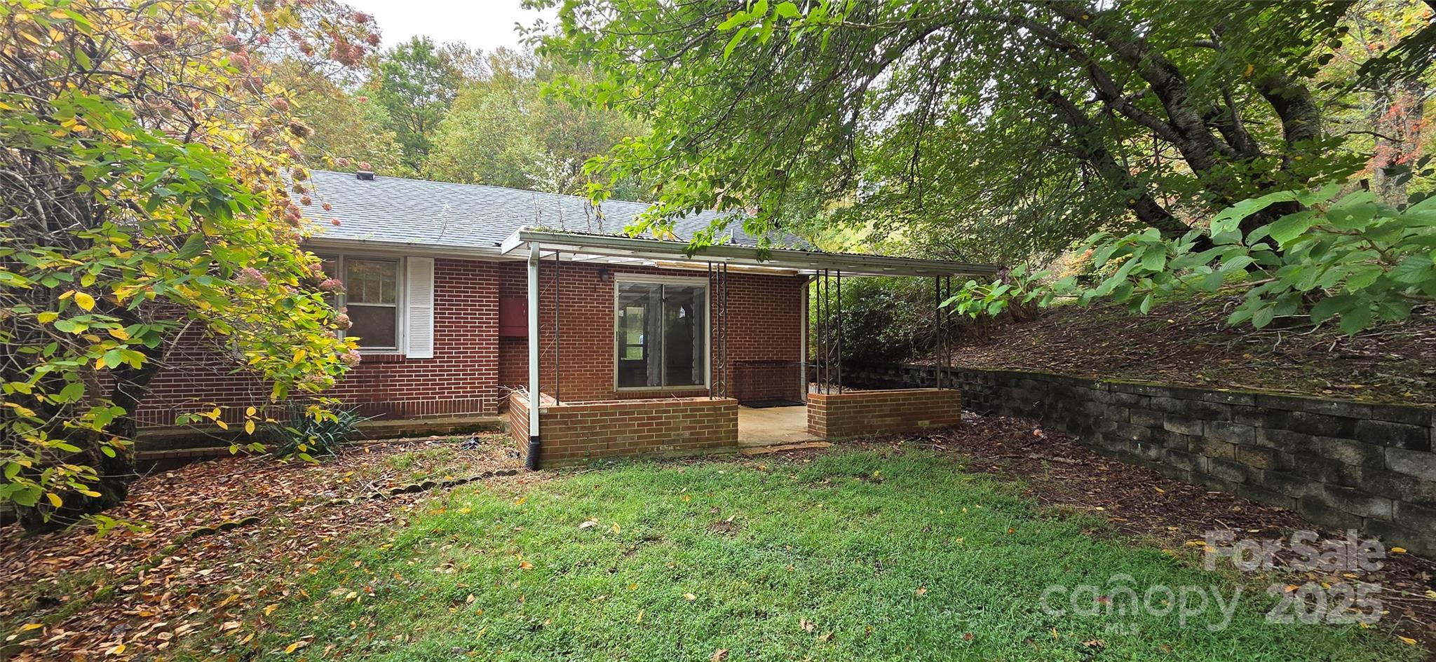 214 Old Dale Road Spruce Pine, NC 28777 - Photo 5 of 42 front view of a house with a yard