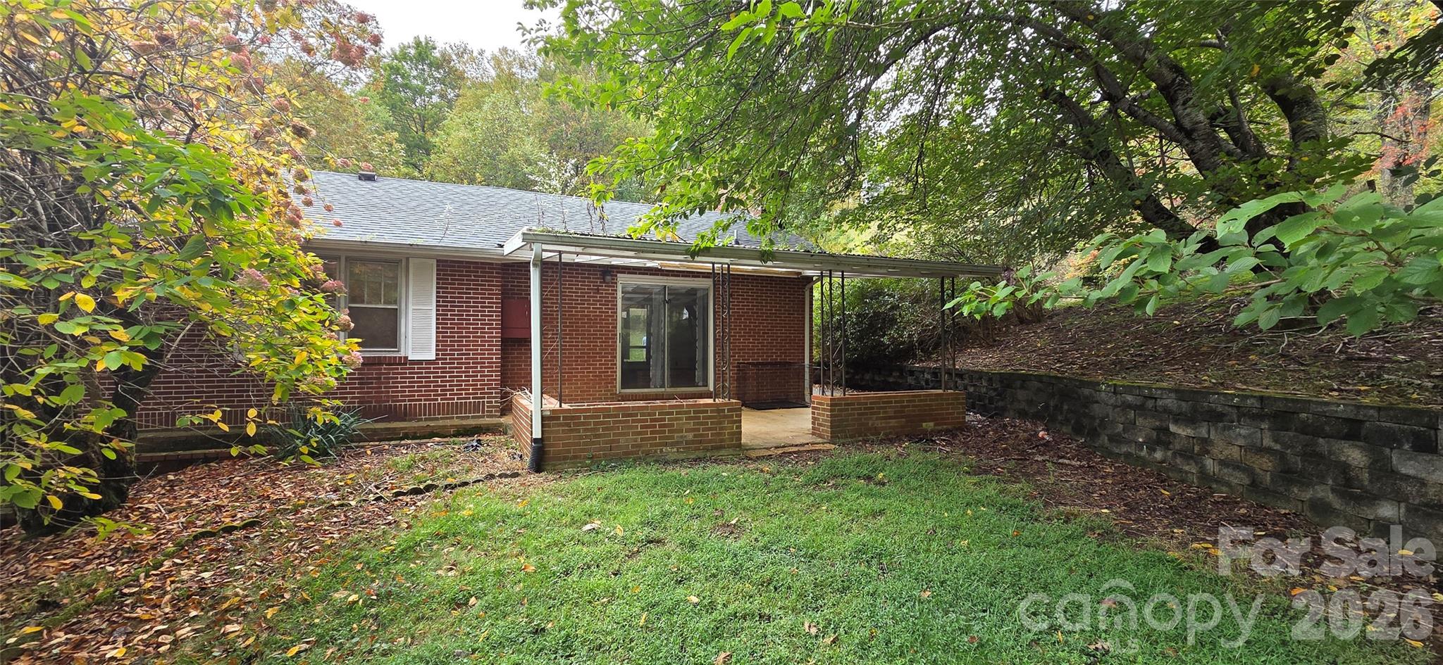 214 Old Dale Road Spruce Pine, NC 28777 - Photo 5 of 39 front view of a house with a yard