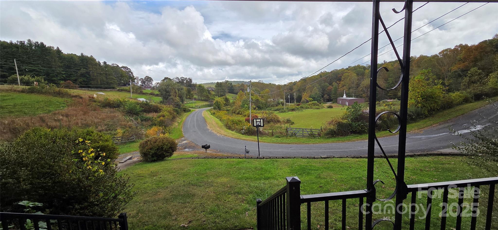 214 Old Dale Road Spruce Pine, NC 28777 - Photo 7 of 42 a view of a garden with mountains in the background