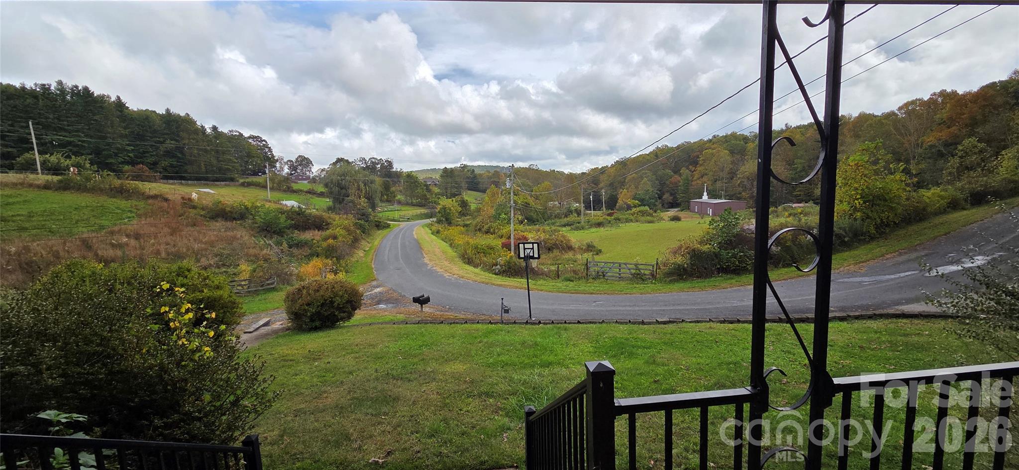214 Old Dale Road Spruce Pine, NC 28777 - Photo 7 of 39 a view of a garden with mountains in the background