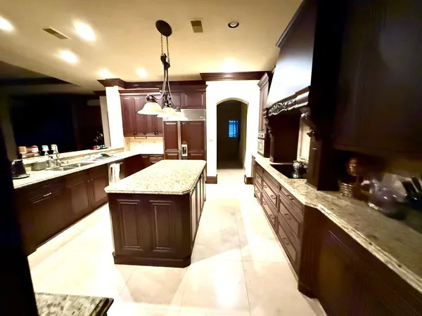 a kitchen with a sink and cabinets